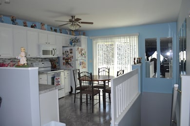 Kitchen with stairs to finished basement