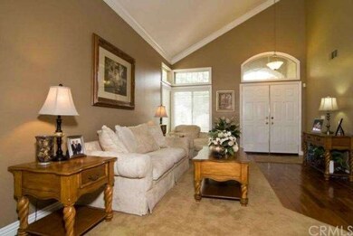 Living room area and double door entry