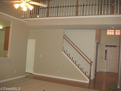 Living Room. Ornate cat walk expands across the newly painted and carpeted livingroom.