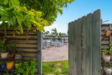 Gate from private, fenced patio to pool/canal area