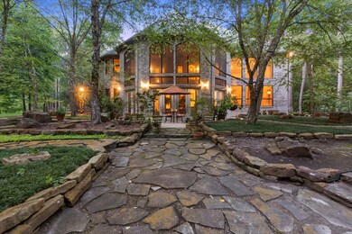 This backyard is amazing! The stone work and the lush landscape truly make this home feel magical.