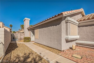 View of home's exterior featuring a gate, stucco s