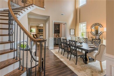 Luxury Grand Staircase and 2-story Dining Room