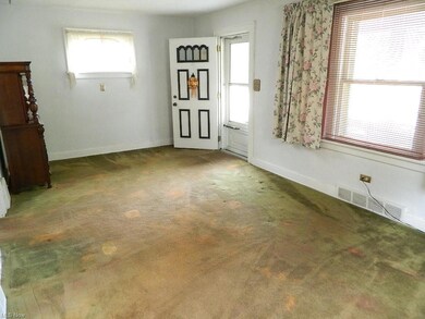 Covered Front Porch Entry to Large Living Room - H