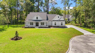 View of front of home with covered porch and a fro