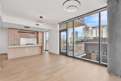 Unfurnished living room with light wood-style flo