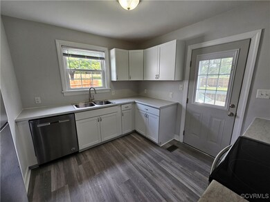 Kitchen featuring a healthy amount of sunlight, st