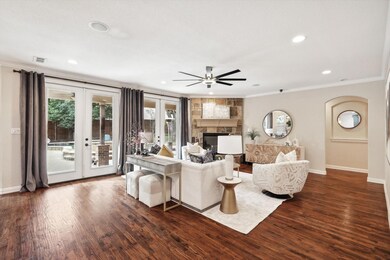 Living room with dark wood-type flooring, french d