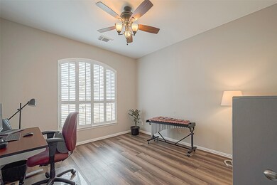 A view of the Study.  These same beautiful floors run through the main living areas and hallways.  There's only carpet in the bedrooms & closets.