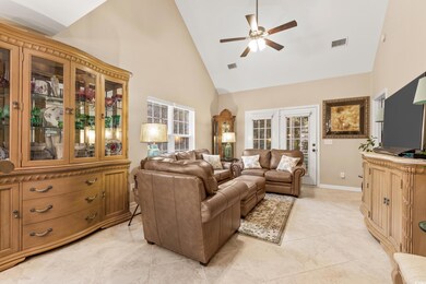 Living room with light tile patterned flooring, a 