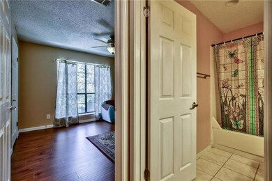 Kitchen with electric range oven, dark tile floors