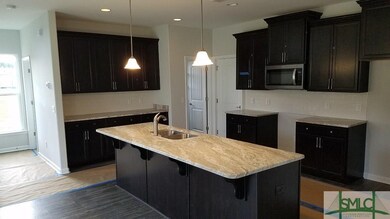Kitchen with Granite Tops and Tile Backsplash