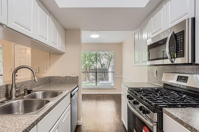 Kitchen featuring stainless steel appliances, a s
