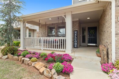 Entrance to property featuring a porch and brick s