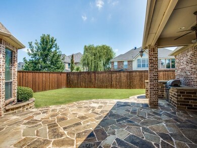 Stone patio, covered with outdoor grill, perfect f