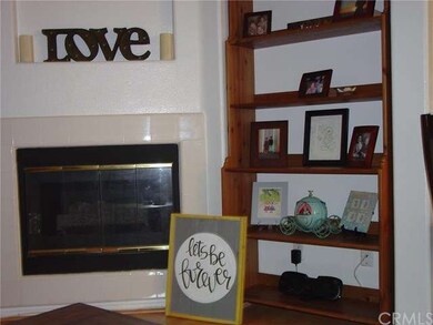 Living room has gas fireplace, laminate wood floor