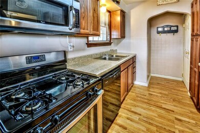 Updated kitchen with hardwood flooring, stainless 
