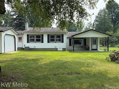View of community featuring a lawn and a water view