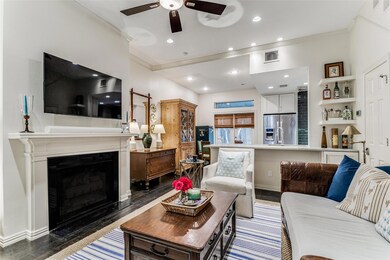 Living room featuring ornamental molding, dark har