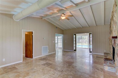 Living room looking into dining room, kitchen and 