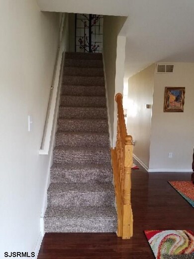 Leading to 3 large bedrooms and a pull-down attic