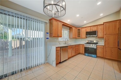 Kitchen with light tile patterned floors, light co