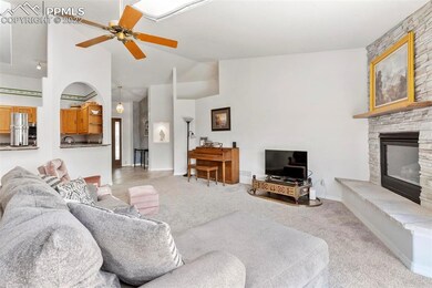 Open floorplan with archway into the Kitchen.