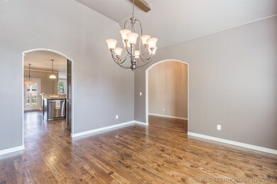 Roomy Dining Room also includes tall, beamed ceili