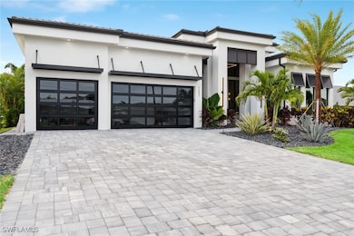 Contemporary house with stucco siding, an attached