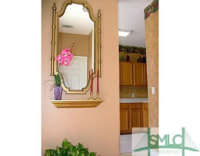 Other. A view from the front hall into the kitchen