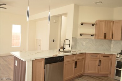 Kitchen featuring appliances with stainless steel