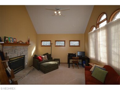 Office/living room with double-sided fireplace.