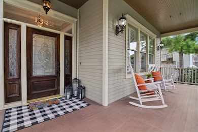 The elegant front entry features a leaded glass do