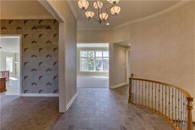 Tiled entry and walkways lead you into this solid,