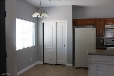 Kitchen with white appliances, under cabinet range