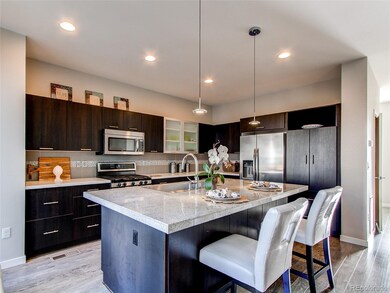Gorgeous kitchen with accent cabinet and stainless