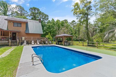 Salt water pool with solar heated shower and gazeb