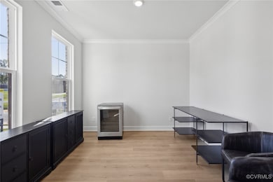 Living area with beverage cooler, light hardwood /