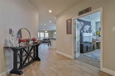 Hallway featuring light wood finished floors and recessed lighting