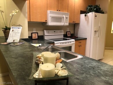 Kitchen breakfast bar will easily seat four.
