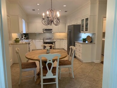Kitchen with range, decorative backsplash, a notab
