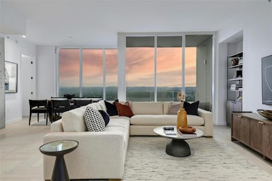 Living area featuring built in features, baseboar