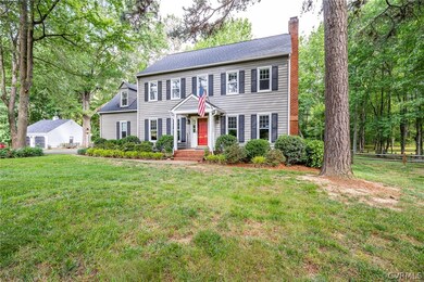 Colonial-style house with a front lawn