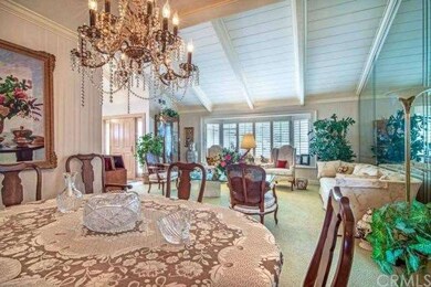 The formal dining area is adjacent to the living r