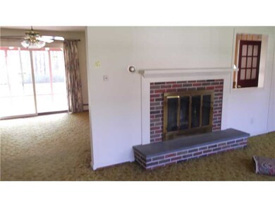 Living Room. Brick fireplace in living room