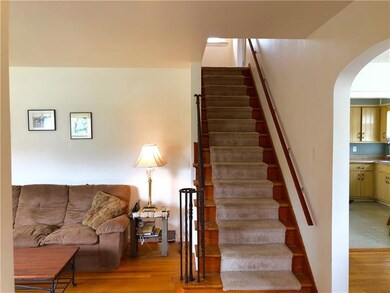 Step inside and be greeted by original hardwoods, 