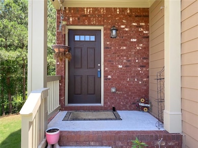 View of exterior entry with a porch
