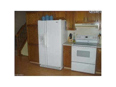 Applianced kitchen with newer side-be-side refrige