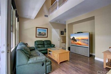 Bright family room with vaulted ceilings and outdo