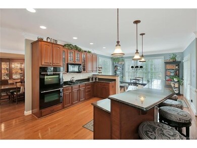 Kitchen with double ovens, gas cooking, black gran